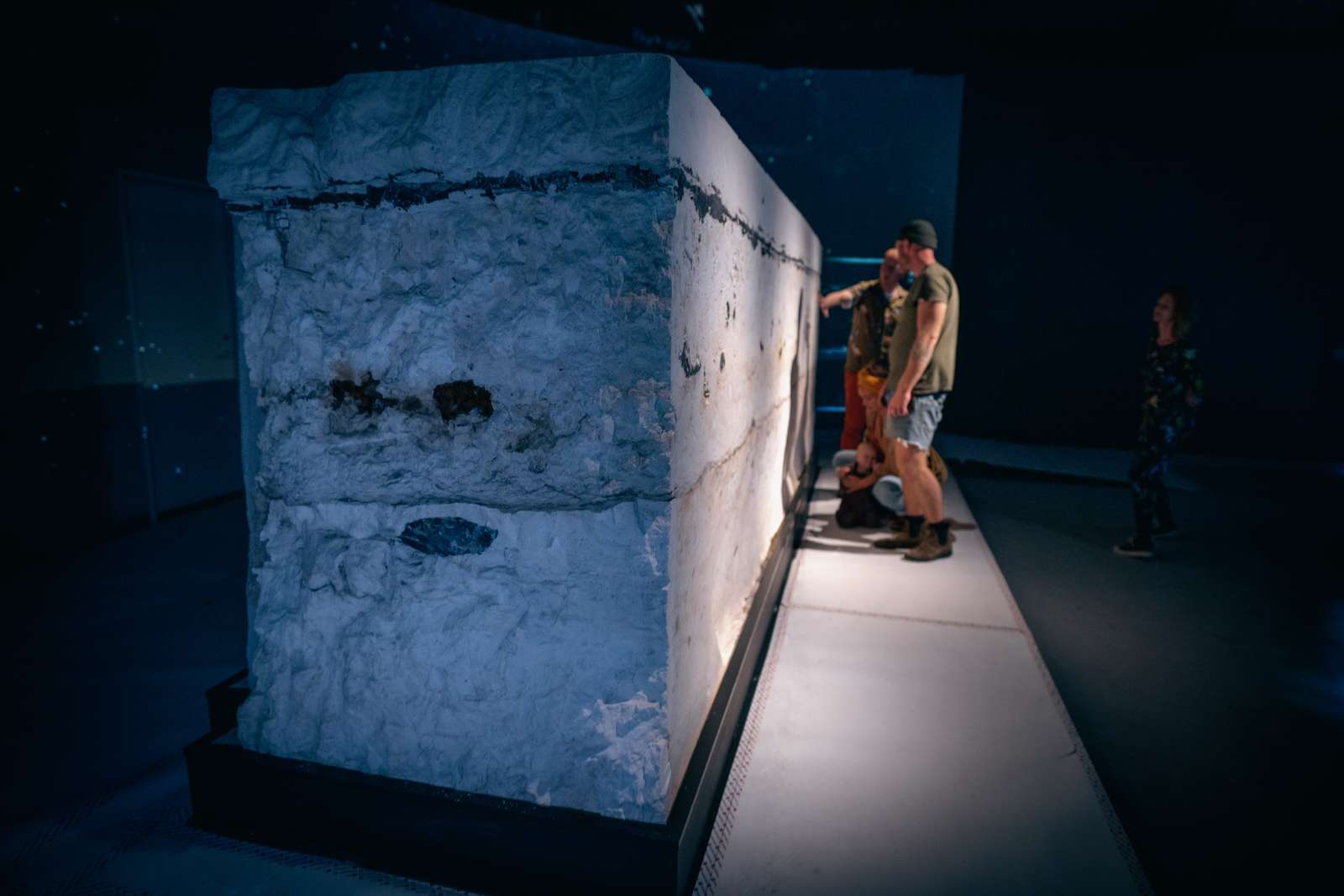People analyzing a piece from the Stevns Klint UNESCO Heritage site