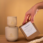 Beige candle set with Copensense branding Shoreline Memory candle next to large 270g jar and packaging box on wood surface.