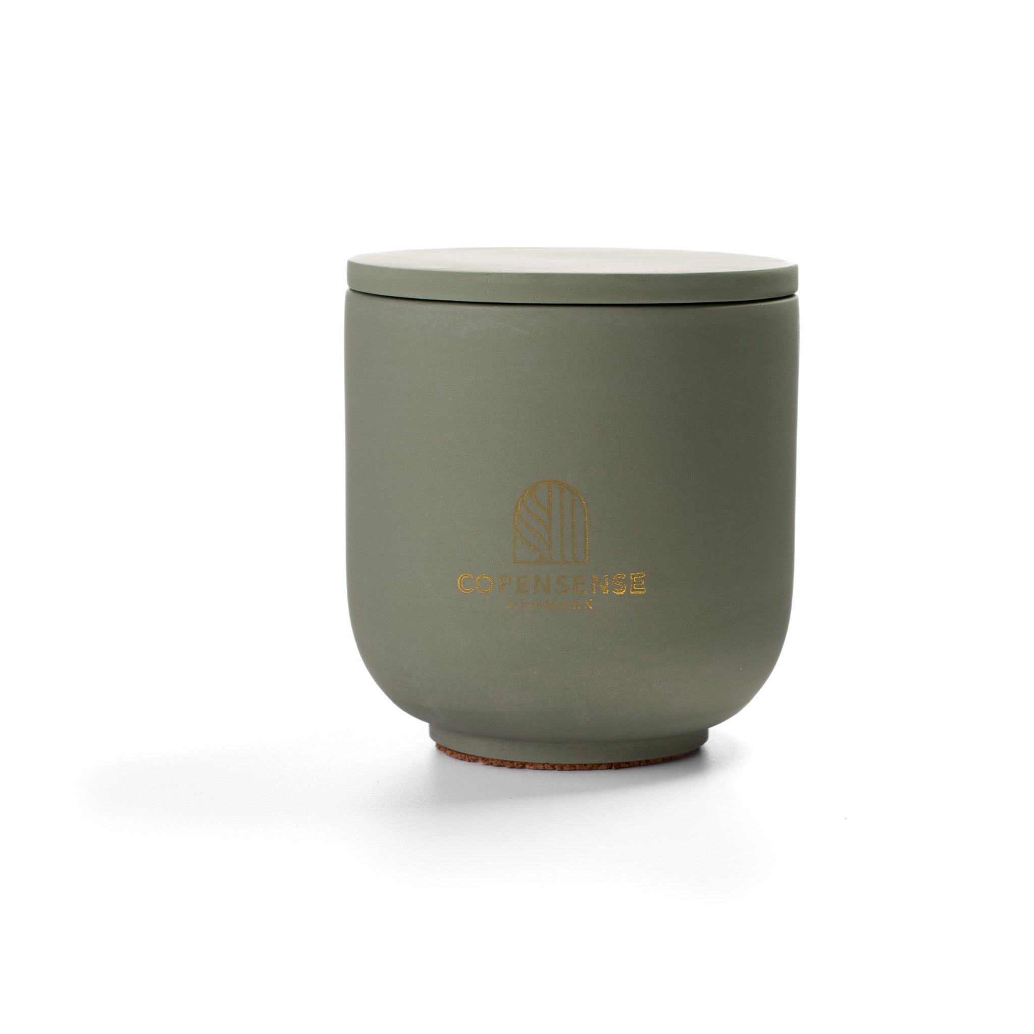 Herbal Sanctuary Scented Candle in Sage Green jar. Fresh basil and rosemary notes. Minimalist Danish design.