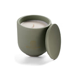 Open Herbal Sanctuary candle showing natural rapeseed wax texture and wooden wick inside green ceramic vessel.