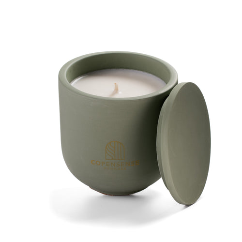 Open Herbal Sanctuary candle showing natural rapeseed wax texture and wooden wick inside green ceramic vessel.