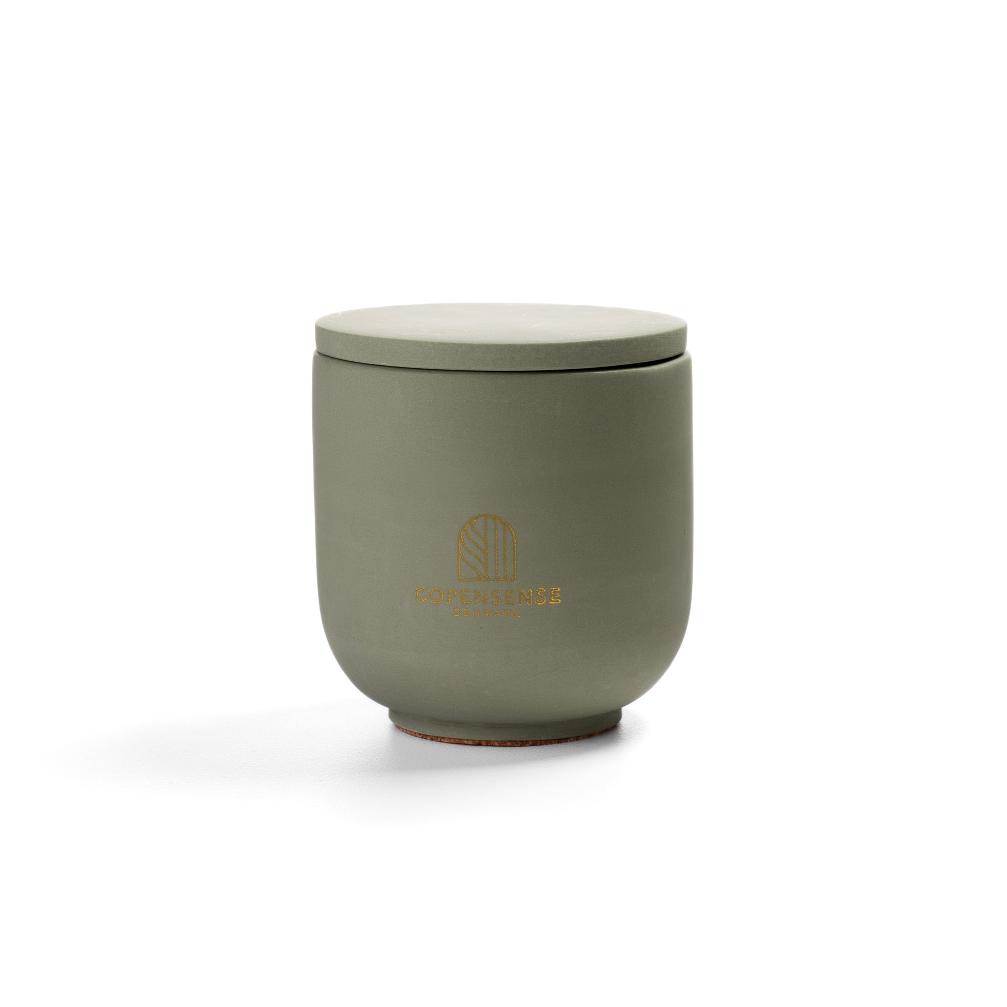Herbal Sanctuary Scented Candle in Sage Green jar. Fresh basil and rosemary notes. Minimalist Danish design.