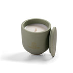 Open Herbal Sanctuary candle showing natural rapeseed wax texture and wooden wick inside green ceramic vessel.