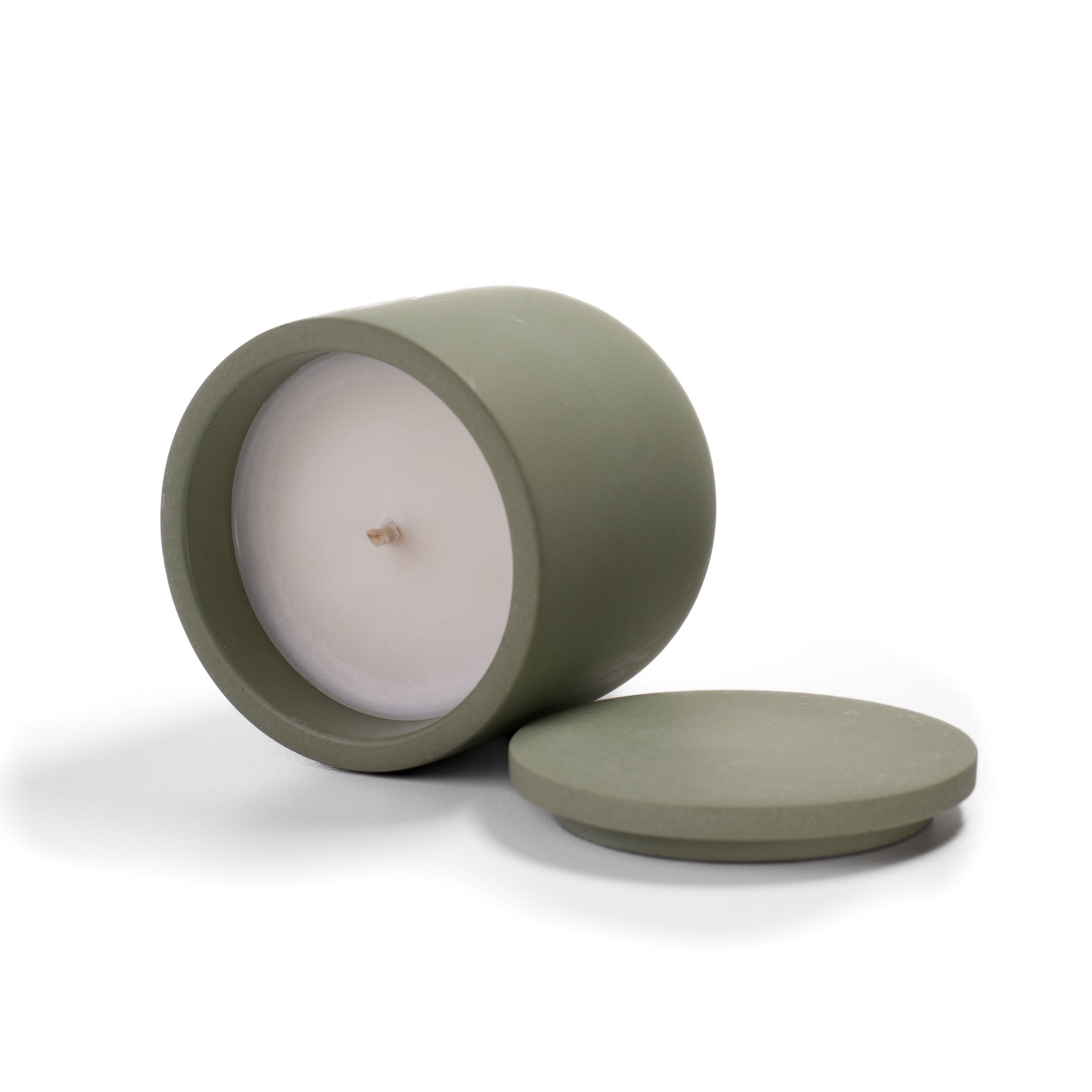 Open Herbal Sanctuary candle showing natural rapeseed wax texture and wooden wick inside green ceramic vessel.