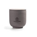 Intense Silence Scented Candle in Nordic Slate grey jar. Amber and leather notes. Minimalist Danish design.