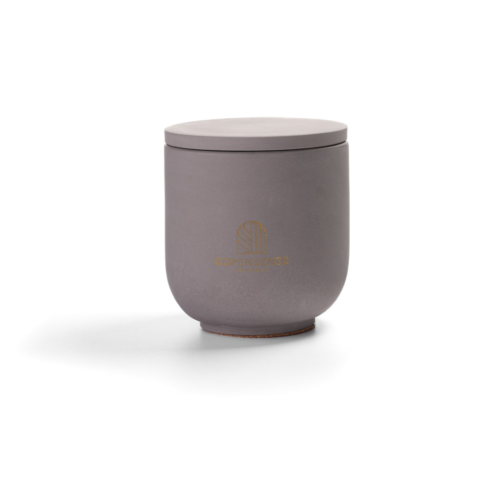 Intense Silence Scented Candle in Nordic Slate grey jar. Notes of amber and leather. 90g, 25h burn time.