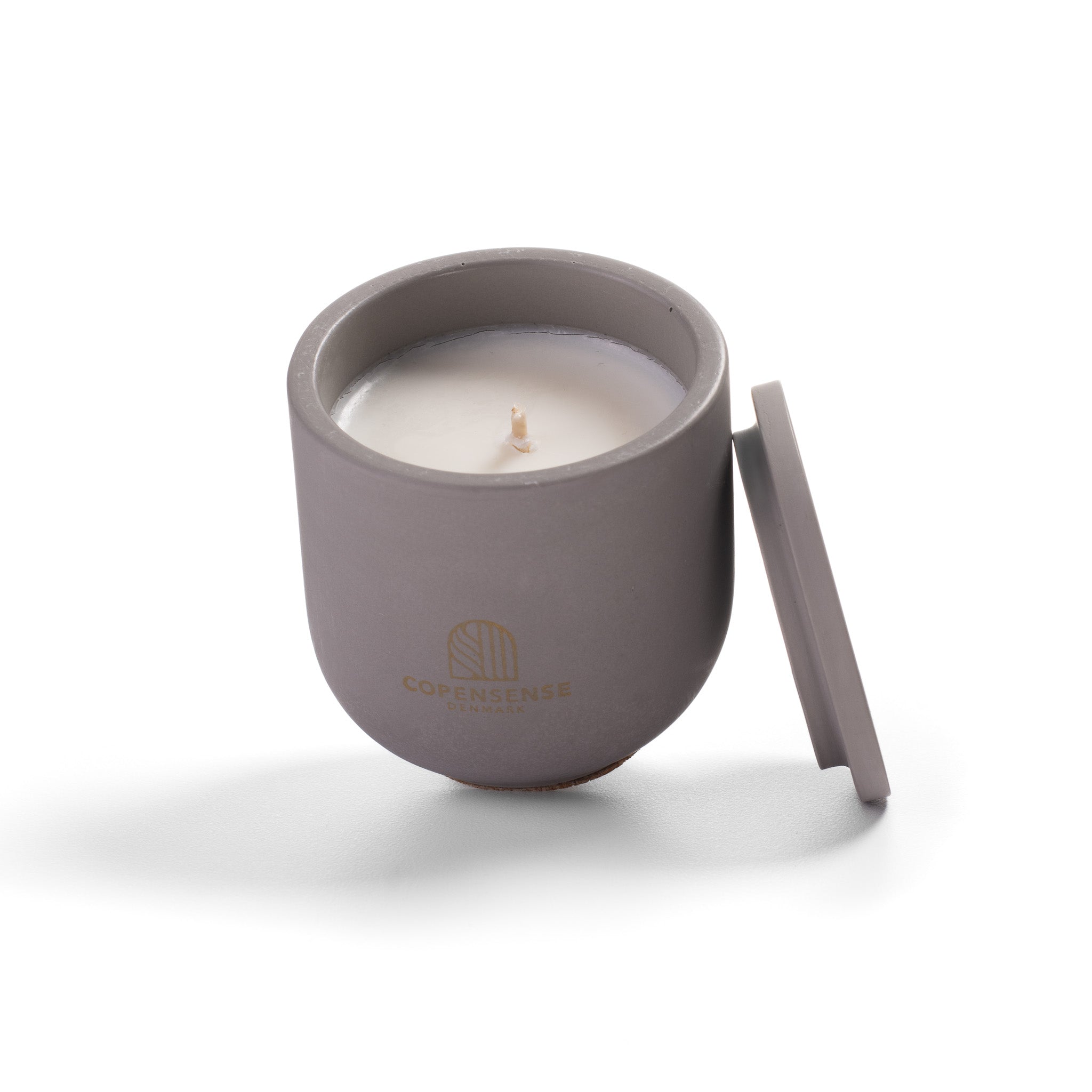 Close up of clean rapeseed wax against dark grey Nordic Slate vessel.