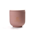 Pure Whisper Scented Candle in Dusty Rose jar. Cotton flower and musk notes. Minimalist Danish design.