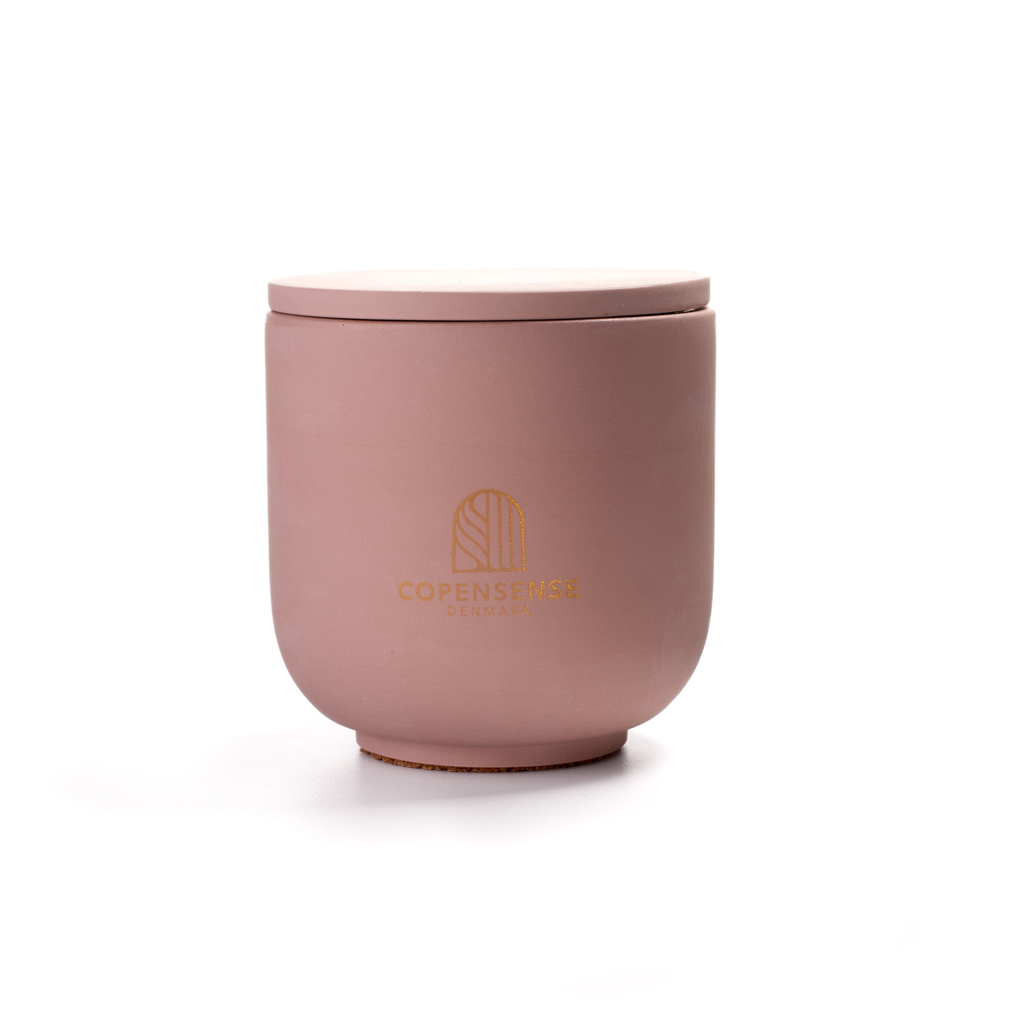 Pure Whisper Scented Candle in Dusty Rose jar. Cotton flower and musk notes. Minimalist Danish design.