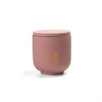 Pure Whisper Scented Candle in Dusty Rose jar. Cotton flower and musk notes. Minimalist Danish design.
