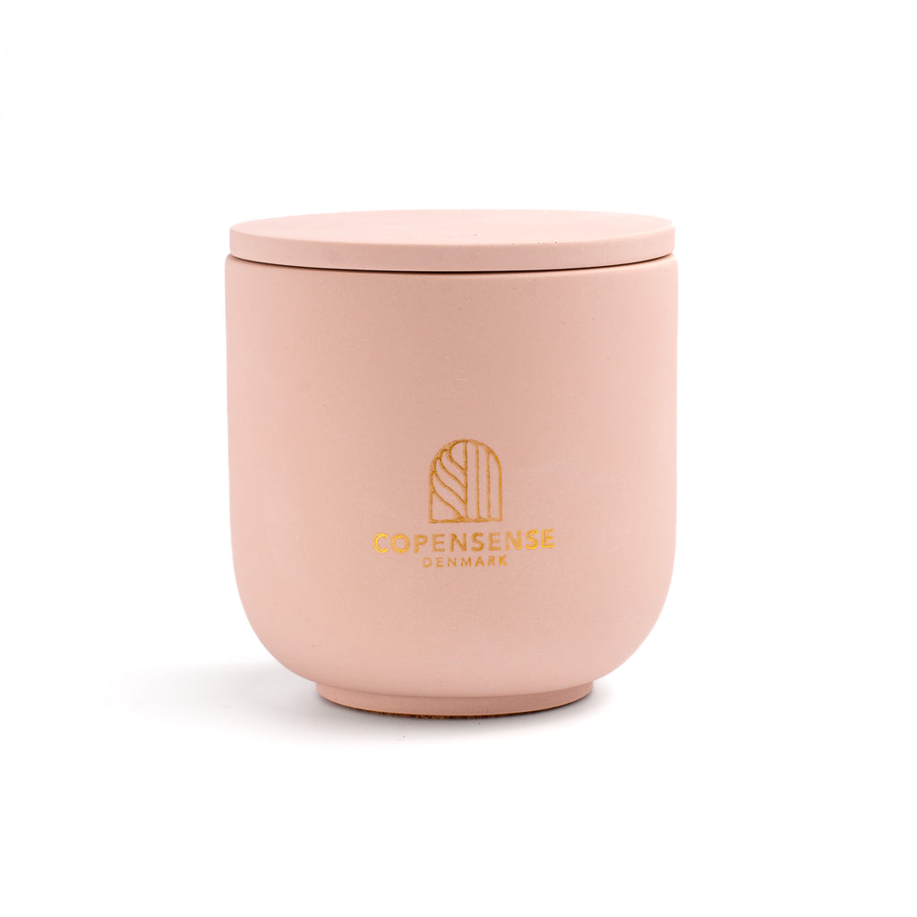 Pure Whisper scented candle in a solid Blush Pink jar, hand-poured in Denmark