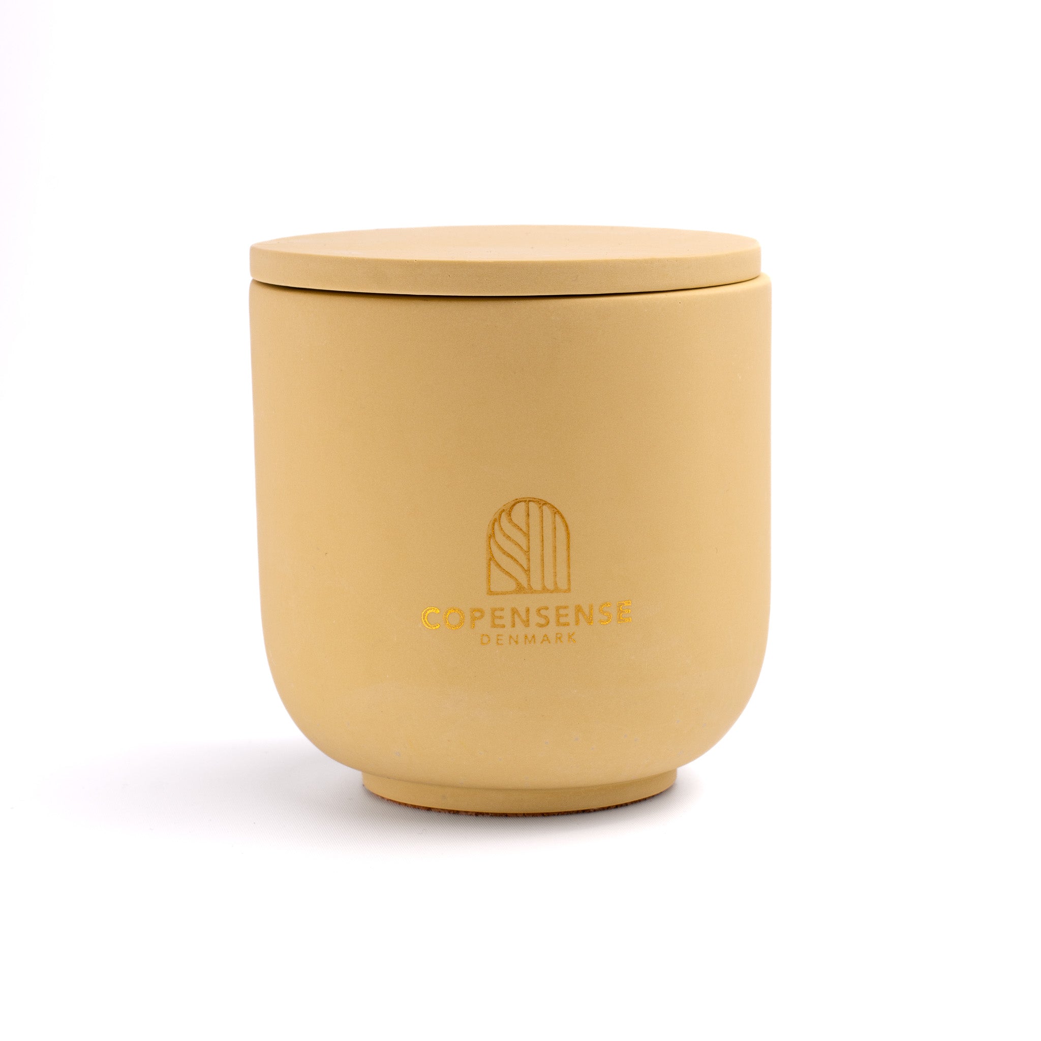 Intense Silence scented candle in a solid Golden Amber jar, hand-poured in Denmark