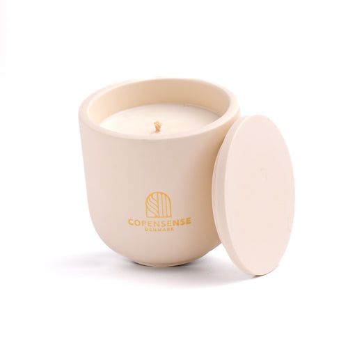 Intense Silence scented candle in a Warm Oat jar, hand-poured in Denmark