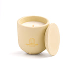 Intense Silence scented candle in a Butter Yellow jar, hand-poured in Denmark