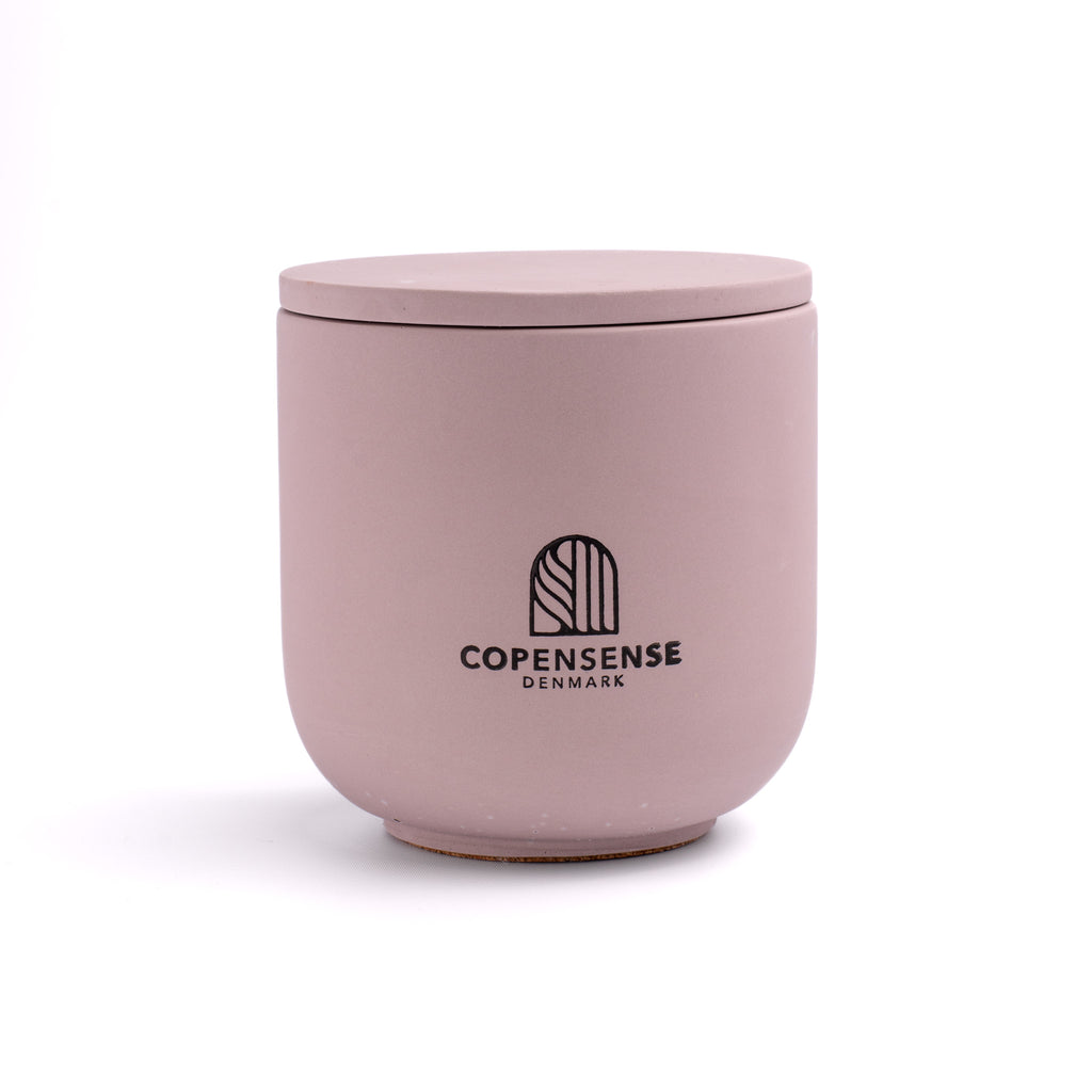 Pure Whisper scented candle in a solid Muted Purple jar, hand-poured in Denmark