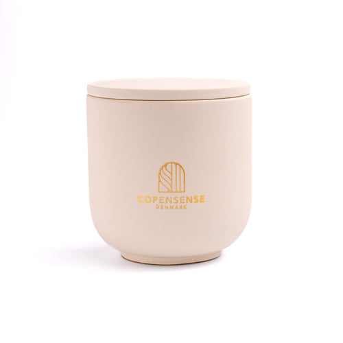 Intense Silence scented candle in a solid Warm Oat jar, hand-poured in Denmark