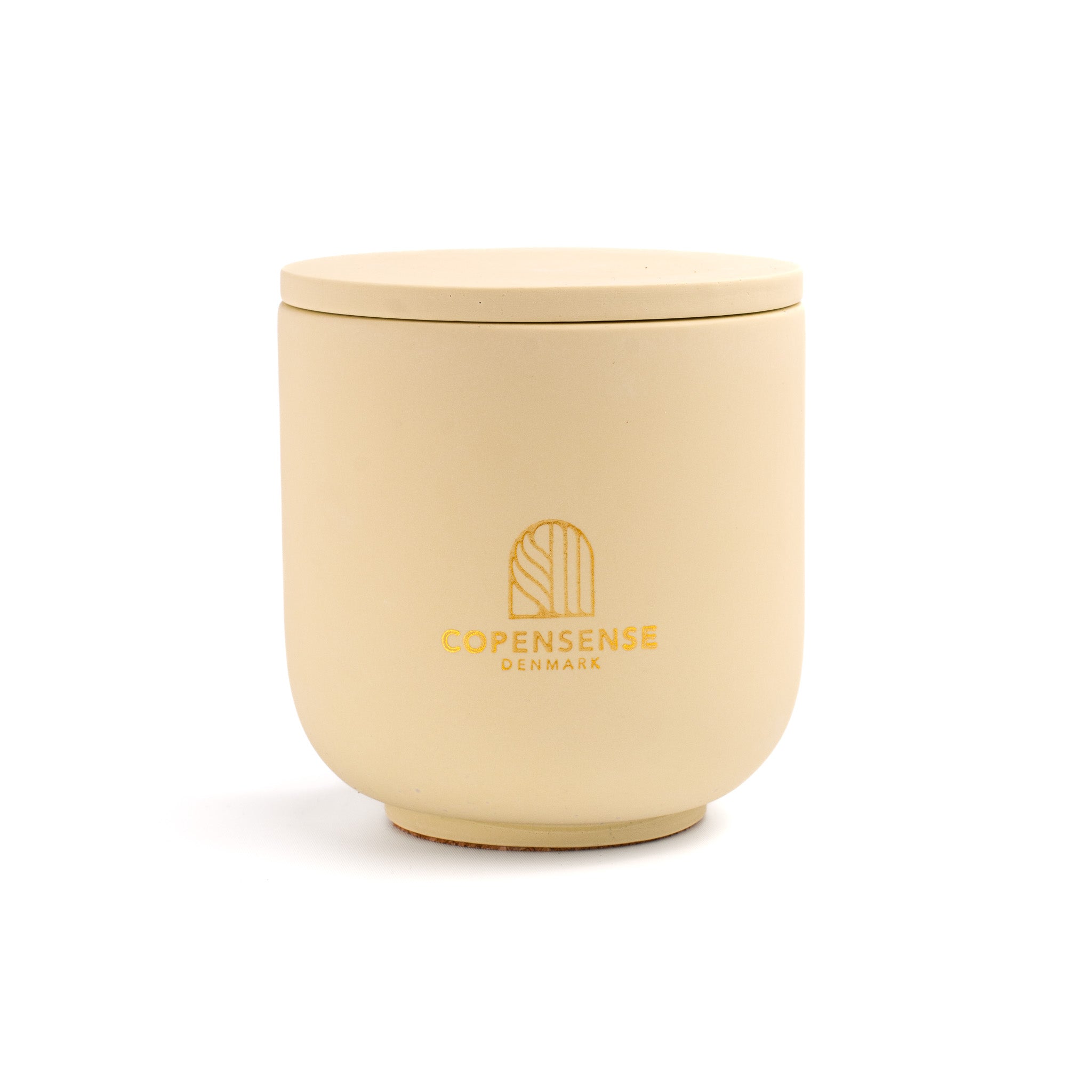 Intense Silence scented candle in a solid Butter Yellow jar, hand-poured in Denmark
